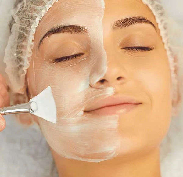 a person getting a facial mask treatment